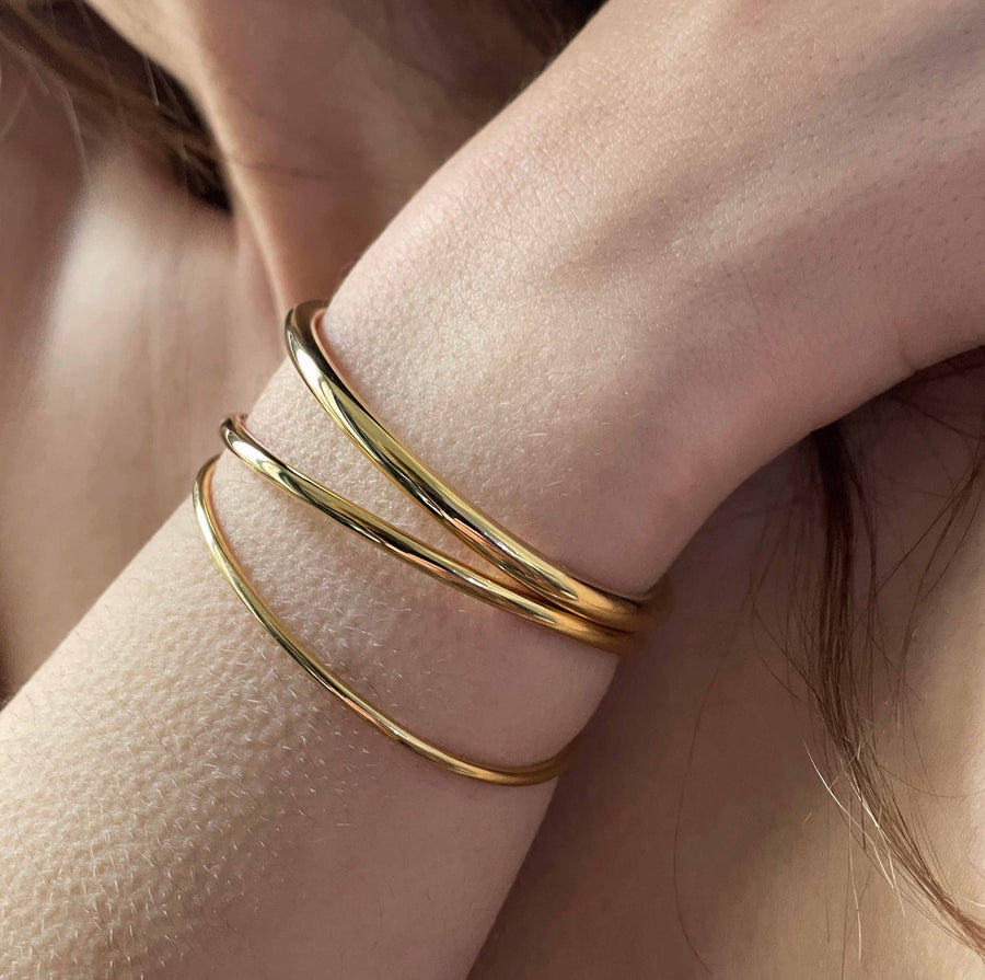 Trio of open vermeil bangles 